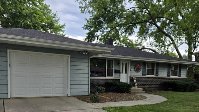 811 N Glenwood Pl, Aurora, IL 60506 - single story home featuring concrete driveway, an attached garage, brick siding, a shingled roof, and a front lawn
