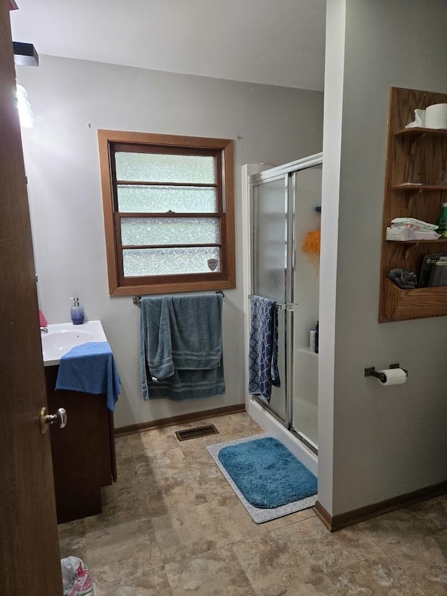 811 N Glenwood Pl, Aurora, IL 60506 - full bath with vanity, a shower stall, and stone finish flooring