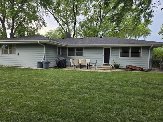 811 N Glenwood Pl, Aurora, IL 60506 - rear view of house featuring a patio, entry steps, and a lawn