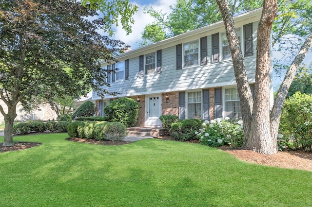 1016 Charleston Dr, Saint Charles, IL 60174 - colonial-style house with a front yard and brick siding