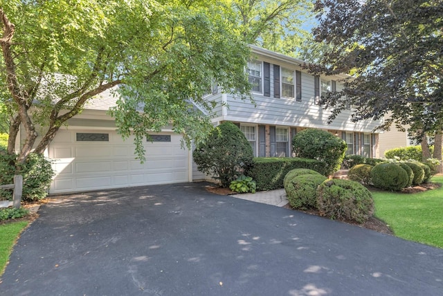 1016 Charleston Dr, Saint Charles, IL 60174 - colonial house with asphalt driveway and a garage