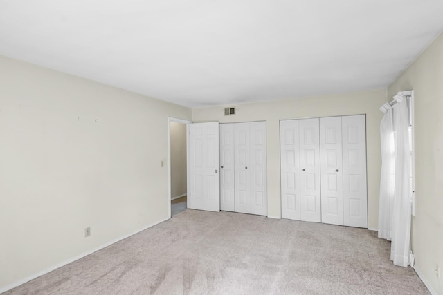 1016 Charleston Dr, Saint Charles, IL 60174 - unfurnished bedroom with multiple closets and carpet floors