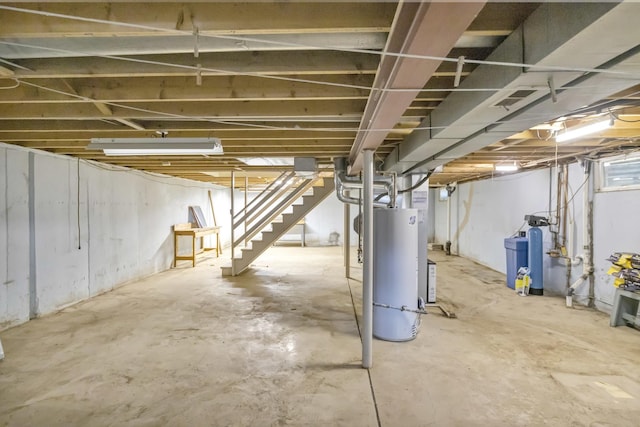 1016 Charleston Dr, Saint Charles, IL 60174 - unfinished basement featuring gas water heater, a water softener system, and stairs