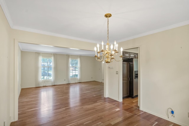 1016 Charleston Dr, Saint Charles, IL 60174 - empty room featuring a chandelier, wood finished floors, and ornamental molding
