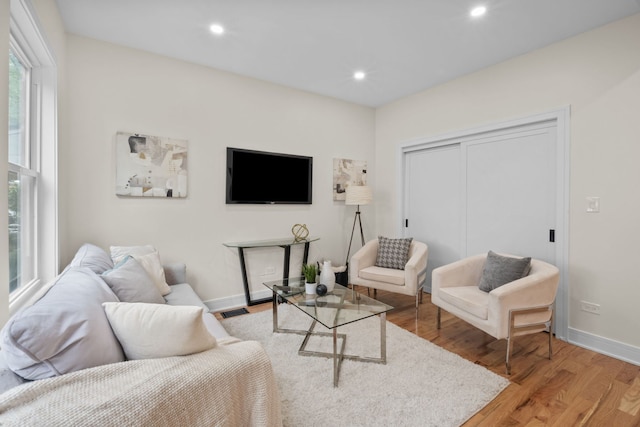 4250 N Whipple St, Chicago, IL 60618 - living area featuring light wood-type flooring and recessed lighting