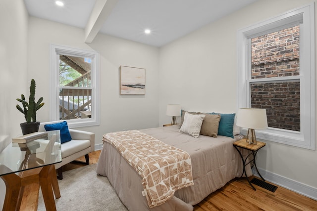 4250 N Whipple St, Chicago, IL 60618 - bedroom featuring light wood-type flooring, recessed lighting, and beam ceiling