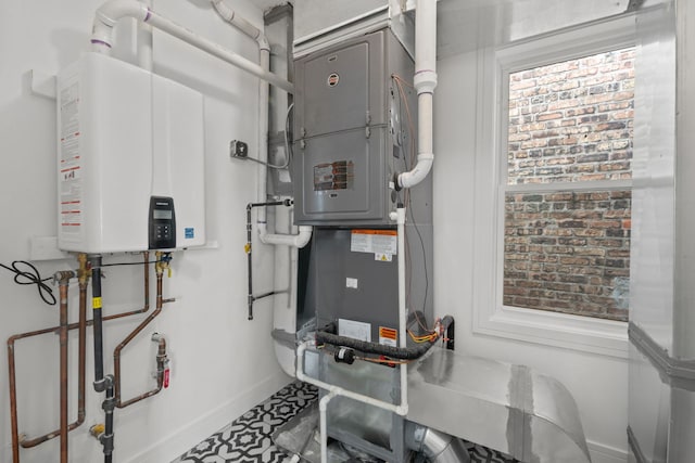 4250 N Whipple St, Chicago, IL 60618 - utility room featuring tankless water heater