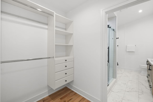 4250 N Whipple St, Chicago, IL 60618 - walk in closet featuring light marble finish floors