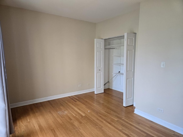 4514 N Ashland Ave Unit B2S, Chicago, IL 60640 - unfurnished bedroom featuring light wood-style floors and a closet