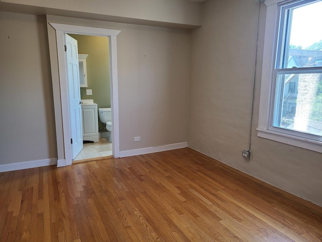 4514 N Ashland Ave Unit B2S, Chicago, IL 60640 - unfurnished room with plenty of natural light and light wood-style floors