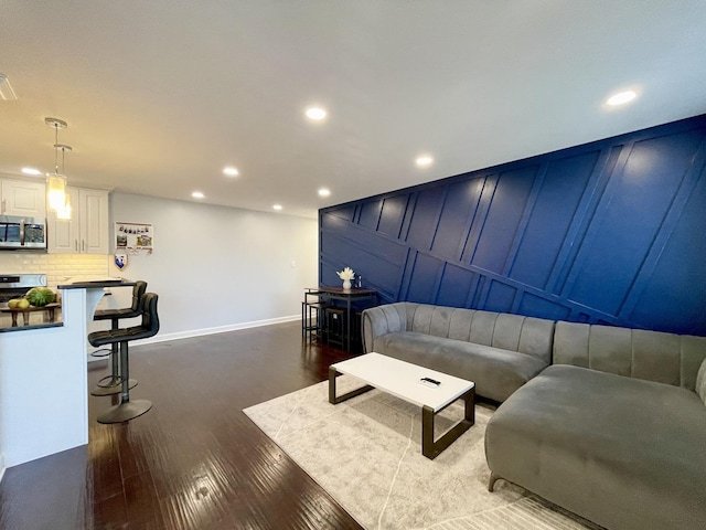 9725 S Karlov Ave Unit 208, Oak Lawn, IL 60453 - living area featuring dark wood-style floors, recessed lighting, and a decorative wall