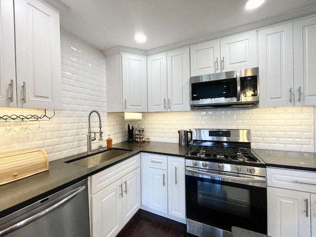 9725 S Karlov Ave Unit 208, Oak Lawn, IL 60453 - kitchen with stainless steel appliances, dark countertops, white cabinetry, backsplash, and recessed lighting