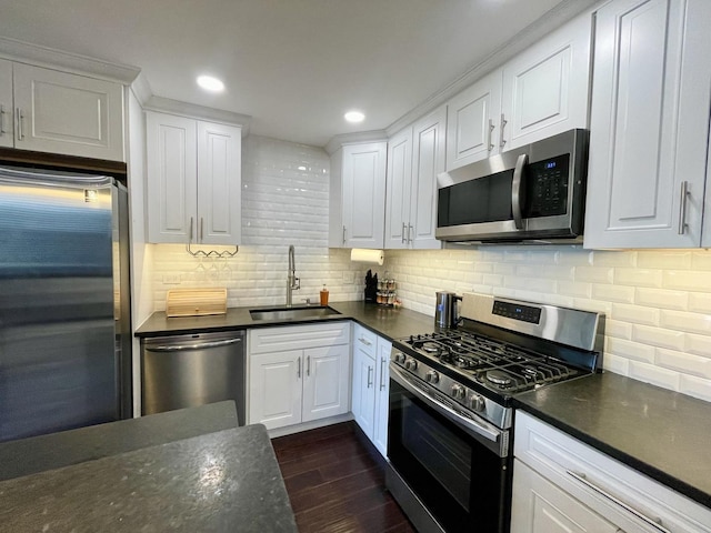 9725 S Karlov Ave Unit 208, Oak Lawn, IL 60453 - kitchen with stainless steel appliances, dark countertops, white cabinets, dark wood finished floors, and recessed lighting