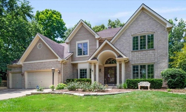 1509 Keim Ct, Saint Charles, IL 60174 - view of front facade featuring brick siding, a garage, a front yard, and driveway