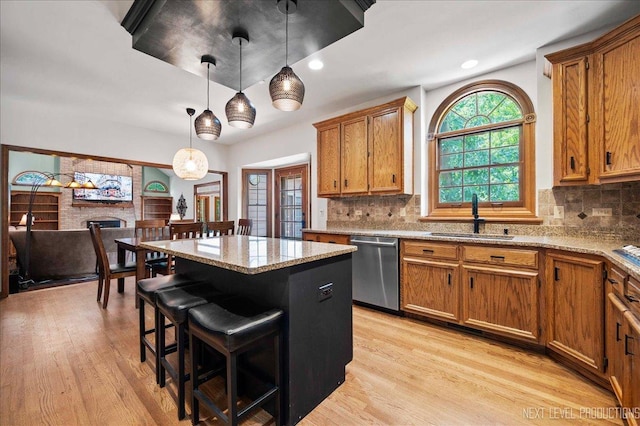 1509 Keim Ct, Saint Charles, IL 60174 - kitchen with stainless steel dishwasher, brown cabinets, a kitchen island, and recessed lighting
