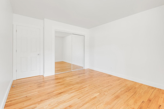 160 E Terra Cotta Ave, Crystal Lake, IL 60014 - unfurnished bedroom with wood finished floors and a closet