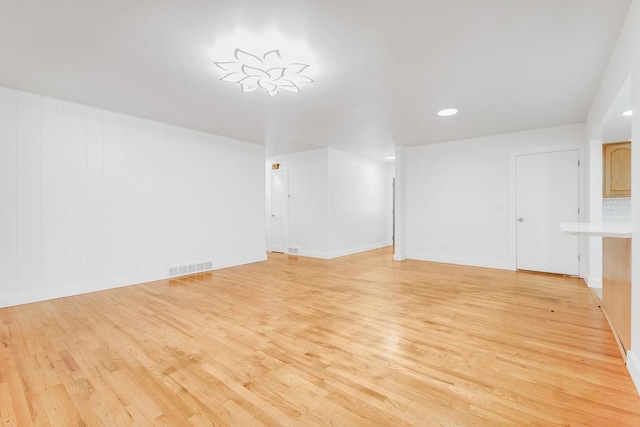 160 E Terra Cotta Ave, Crystal Lake, IL 60014 - unfurnished living room with light wood finished floors and recessed lighting