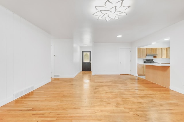160 E Terra Cotta Ave, Crystal Lake, IL 60014 - unfurnished living room featuring light wood-style floors and recessed lighting