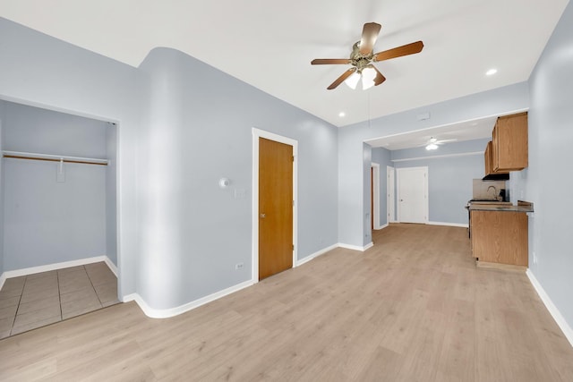 3826 S Honore St, Chicago, IL 60609 - unfurnished living room with a ceiling fan, light wood finished floors, and recessed lighting