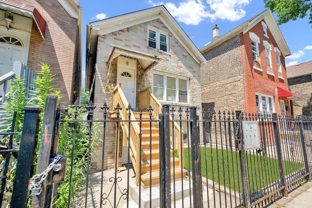 3826 S Honore St, Chicago, IL 60609 - view of front of property with a gate, a fenced front yard, stone siding, and brick siding