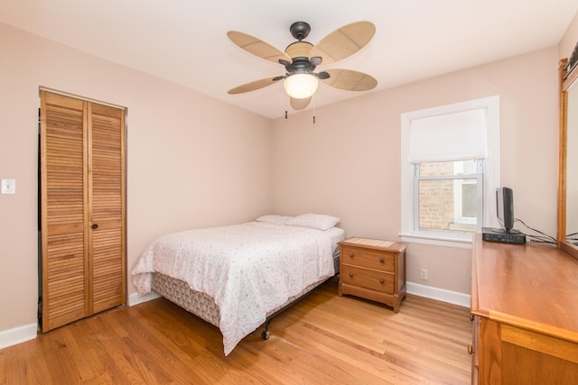 3345 N Page Ave, Chicago, IL 60634 - bedroom with light wood-style floors, a closet, and ceiling fan