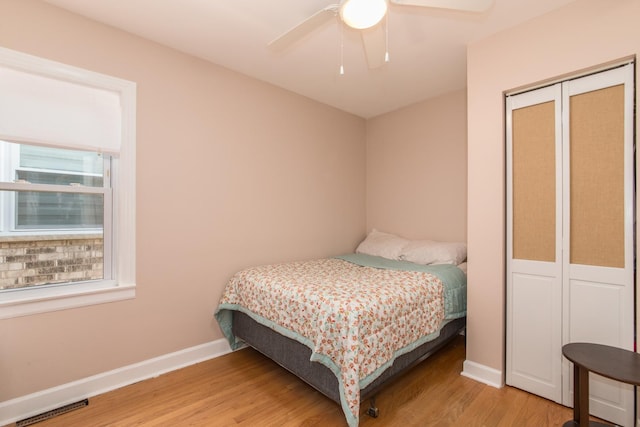 3345 N Page Ave, Chicago, IL 60634 - bedroom featuring light wood-type flooring, a ceiling fan, and a closet
