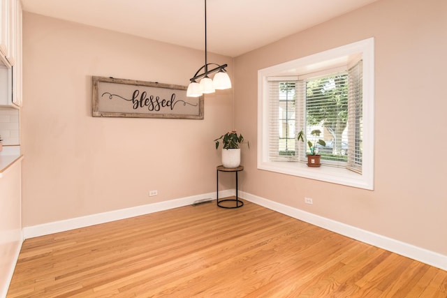 3345 N Page Ave, Chicago, IL 60634 - unfurnished room with light wood-type flooring and baseboards