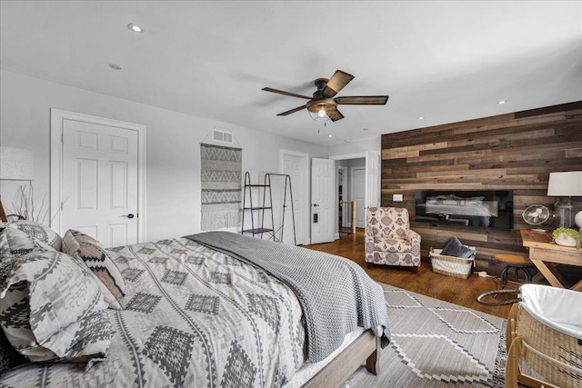 6 Barbados Ct N, Putnam, IL 61560 - bedroom featuring wood walls, wood finished floors, ceiling fan, and recessed lighting