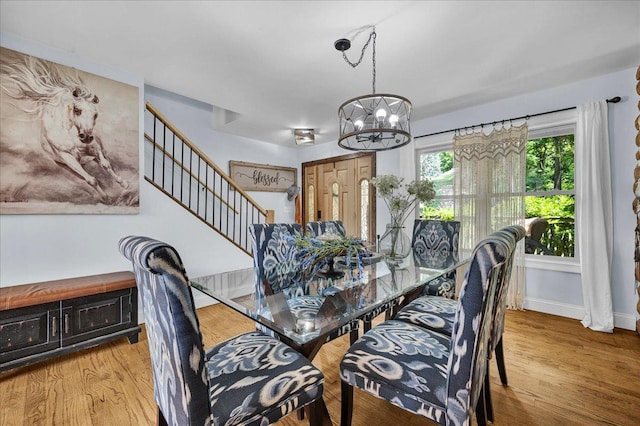 6 Barbados Ct N, Putnam, IL 61560 - dining room featuring a chandelier, wood finished floors, and stairway