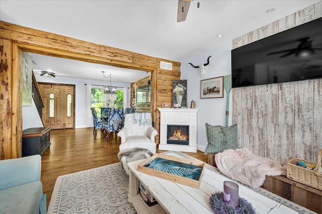 6 Barbados Ct N, Putnam, IL 61560 - living room featuring wood finished floors, a ceiling fan, and a glass covered fireplace