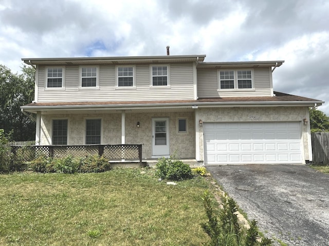 19708 S Skye Dr, Frankfort, IL 60423 - view of front of property featuring asphalt driveway, covered porch, and an attached garage