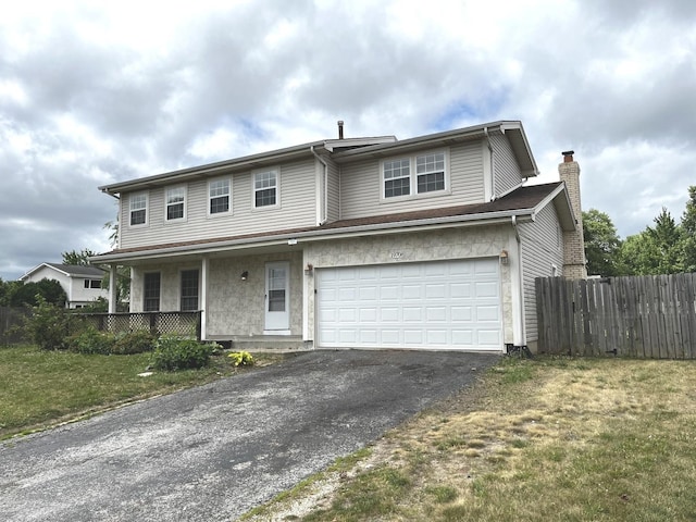 19708 S Skye Dr, Frankfort, IL 60423 - view of front of property featuring asphalt driveway, covered porch, a chimney, and an attached garage