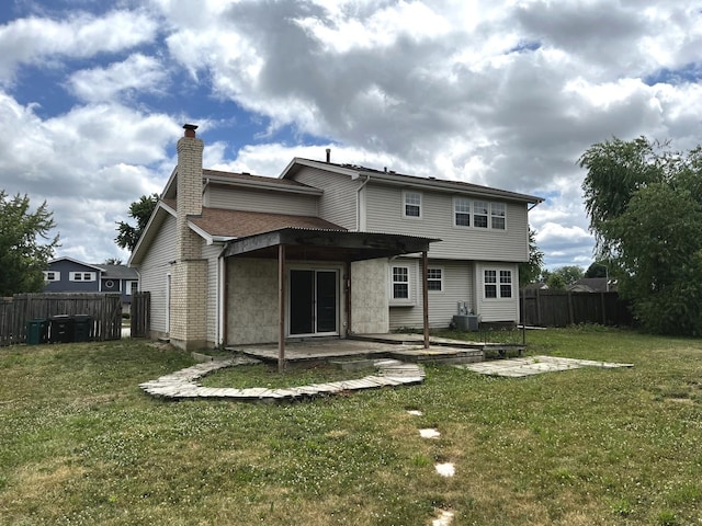 19708 S Skye Dr, Frankfort, IL 60423 - rear view of house with a patio area and a chimney