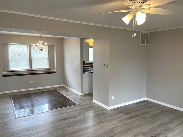 19708 S Skye Dr, Frankfort, IL 60423 - unfurnished dining area with plenty of natural light, wood finished floors, ornamental molding, a chandelier, and a ceiling fan