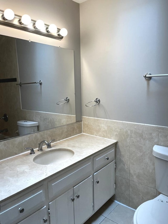 19708 S Skye Dr, Frankfort, IL 60423 - bathroom with tile walls, vanity, tile patterned flooring, and a wainscoted wall
