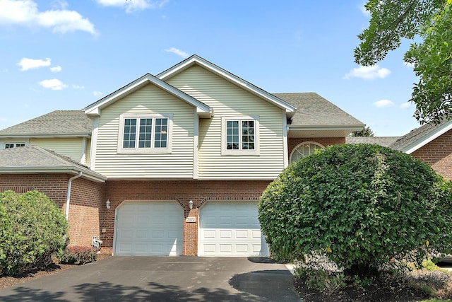 7672 Thistlewood Ln, Frankfort, IL 60423 - view of front of home featuring brick siding, asphalt driveway, and a garage