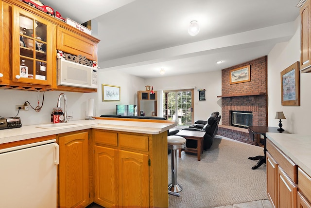 7672 Thistlewood Ln, Frankfort, IL 60423 - kitchen featuring white microwave, open floor plan, light countertops, glass insert cabinets, and light carpet