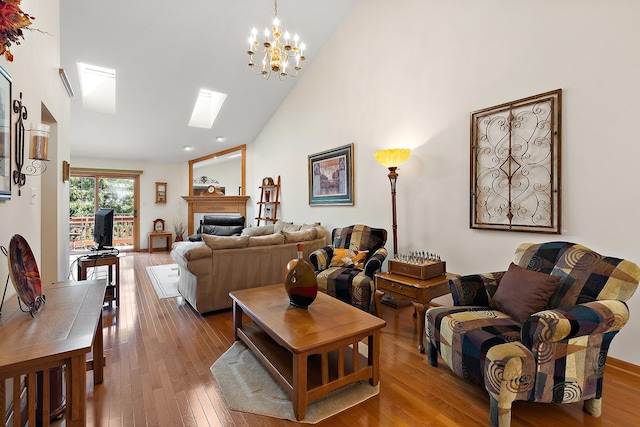7672 Thistlewood Ln, Frankfort, IL 60423 - living area with a skylight, wood-type flooring, high vaulted ceiling, a chandelier, and a fireplace