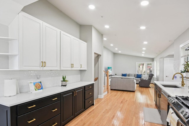 1610 S Greenwood Ave, Park Ridge, IL 60068 - kitchen with stainless steel range with gas cooktop, white cabinetry, backsplash, open shelves, and recessed lighting