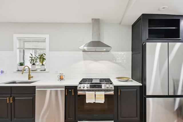 1610 S Greenwood Ave, Park Ridge, IL 60068 - kitchen with stainless steel appliances, wall chimney range hood, light countertops, and decorative backsplash