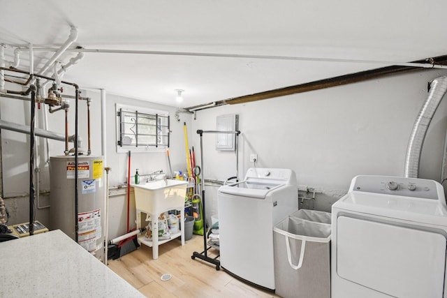 1610 S Greenwood Ave, Park Ridge, IL 60068 - laundry room with washing machine and clothes dryer, gas water heater, light wood-style flooring, and electric panel