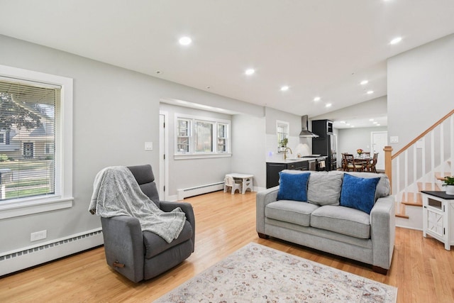 1610 S Greenwood Ave, Park Ridge, IL 60068 - living area featuring baseboard heating, stairway, light wood finished floors, healthy amount of natural light, and recessed lighting