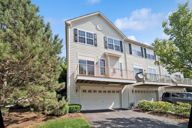 234 Cassidy Ln, Elgin, IL 60124 - view of front of home with a garage, driveway, and a balcony