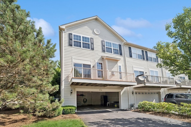 234 Cassidy Ln, Elgin, IL 60124 - view of front of home featuring a garage and asphalt driveway