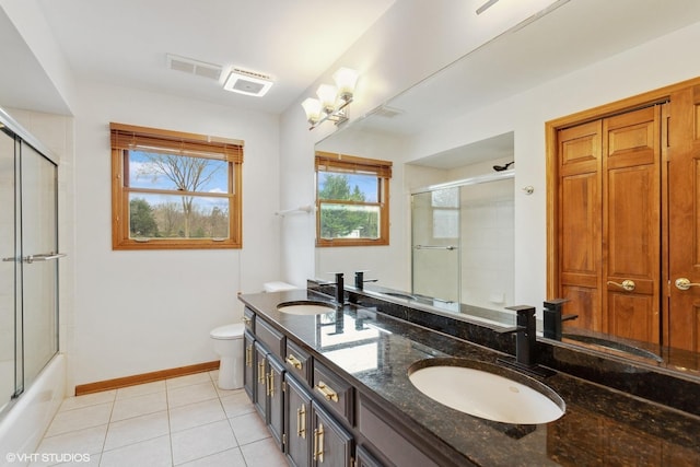 13714 S Janas Pkwy, Homer Glen, IL 60491 - full bathroom with double vanity, healthy amount of natural light, tile patterned flooring, and bath / shower combo with glass door