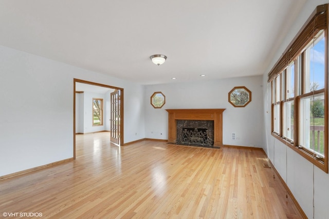 13714 S Janas Pkwy, Homer Glen, IL 60491 - unfurnished living room with light wood-type flooring and a high end fireplace