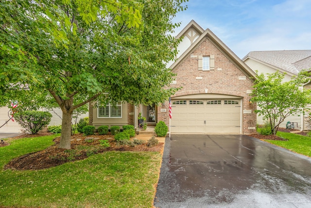 1728 Briarheath Dr, Aurora, IL 60505 - view of front of property featuring brick siding, asphalt driveway, and an attached garage