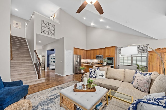 1728 Briarheath Dr, Aurora, IL 60505 - living room featuring dark wood-style flooring, ceiling fan, stairs, high vaulted ceiling, and recessed lighting