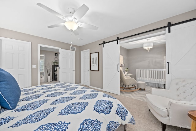 1728 Briarheath Dr, Aurora, IL 60505 - bedroom featuring a barn door, carpet floors, and ceiling fan