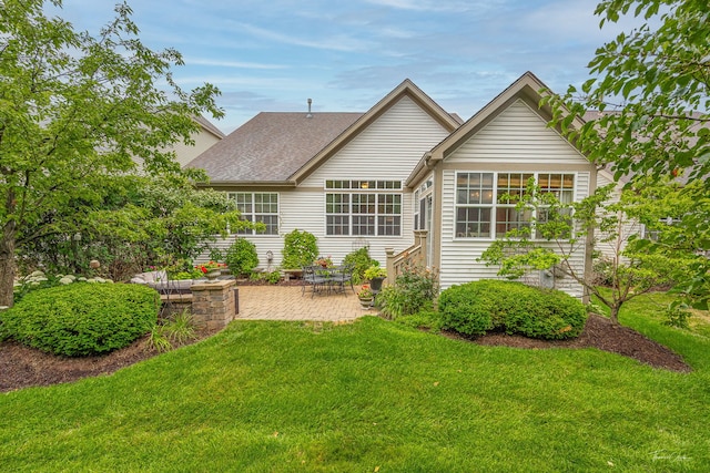 1728 Briarheath Dr, Aurora, IL 60505 - rear view of property featuring a patio, a lawn, and roof with shingles
